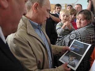 Poetin praat met slachtoffers